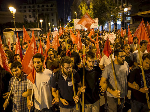 'No' supporters celebrate referendum results on a street in central in Athens, Greece July 5, 2015. Greeks voted overwhelmingly 'No' on Sunday in a historic bailout referendum, partial results showed, defying warnings from across Europe that rejecting new austerity terms for fresh financial aid would set their country on a path out of the euro.  Reuters Photo.