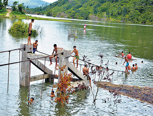 A bridge in Chadong village of Ukhrul district in Manipur, inhabited by the Thunkul Nagas, has been submerged for almost a month by the rising waters of the Mapithel dam of the Thoubal Multipurpose Project.  DEEPAK OINAM