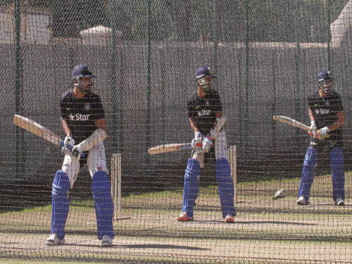 Indian batsmen (from left) M Vijay, Manoj Tiwari and Robin Uthappa bat at 'nets' in Harare. AP