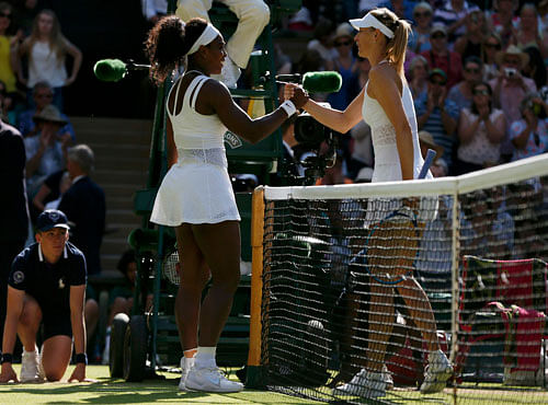 Serena Williams of the U.S.A. shakes hands with Maria Sharapova of Russia after winning their match at the Wimbledon Tennis Championships in London. Reuters photo