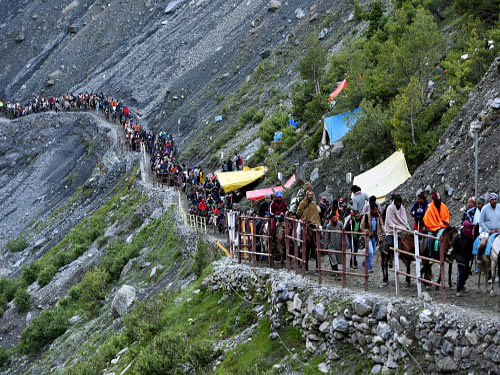 Amarnath Yatra was today suspended on Baltal and Pahalgam routes due to incessant rainfall. So far, more that 1.10 lakh pilgrims have paid obeisance to the naturally-formed ice shivlingam inside the 3,880 meter high cave shrine. PTI photo