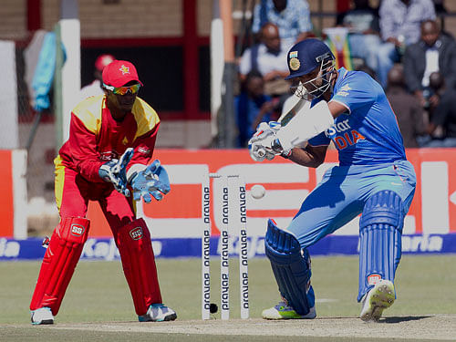 Indian batsman Ambati Rayudi, plays a shot while Zimbabwean wicketkeeper Richmond Mutumbami looks on during the first One Day International against Zimbabwe in Harare, Friday. AP Photo.