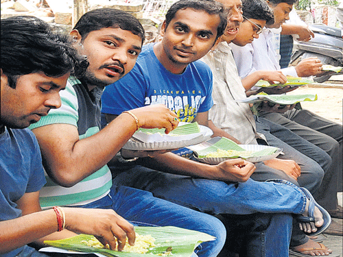 Customers savouring the delicacies.
