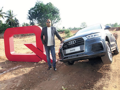 Gajanan Hegdekatte, Business Head, (Sales and Marketing), Audi Bengaluru, is seen next to an Audi Q3 at the recent Audi Q-Drive in Bengaluru.