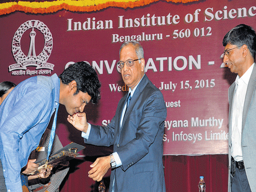 well done:  Infosys Emeritus Chairman N R Narayana Murthy presents the Computer Society of India Medal (Bengaluru chapter) to Arpit Agarwal of the Computer Science and Automation Department at the IISc convocation 2015 in the City on Wednesday. IISc Director Anurag Kumar is also seen. DH photo