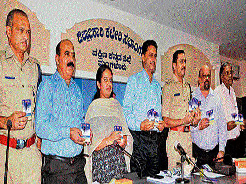 Deputy Commissioner A B Ibrahim releases 'Hello SOS' directory during  Disaster Management Authority meeting at DC office in Mangaluru on Thursday. SP Dr S D Sharanappa, ADC Sadashiva Prabhu, Zilla Panchayat CEO I P Sreevidya and others look on. dh photo
