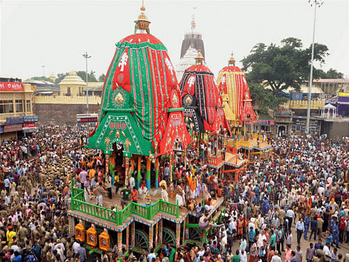 Police forces pull a chariot to set in front of the Lord Jagannath temple on the eve of the annual Rath Yatra, or Chariot procession at Puri, 65 kilometers (40 miles) away from Bhubaneswar in Odhisa on Friday. PTI Photo