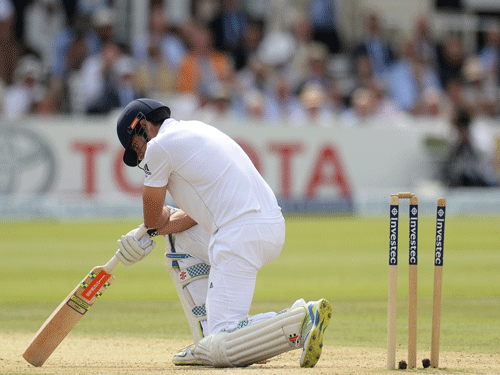 Alastair Cook looks dejected after being bowled out . Reuters