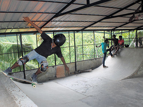 A boy learns skateboarding at Vizhinjam near Thiruvananthapuram