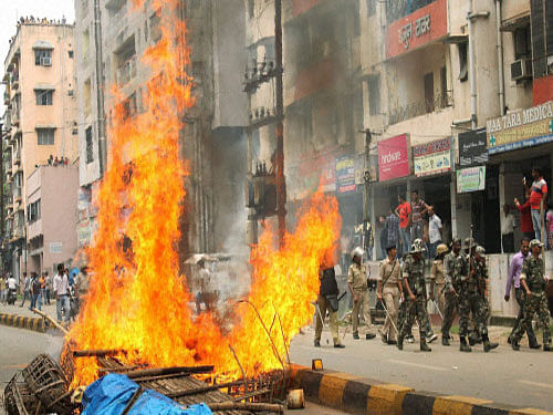 A mob burnt tyres following which members of the two communities clashed. Police said both the communities resorted to violence at many places and burnt vehicles. PTI photo