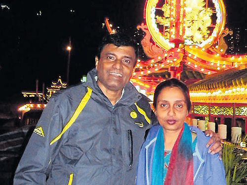 Avid travellers The author with husband Chandran.
