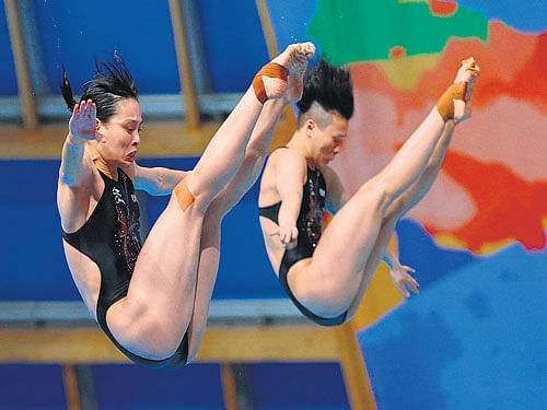 PLUNGE TO THE PINNACLE China's Shi Tingmao and Wu Minxia compete during the women's 3M Synchro Springboard diving final at the World Championships in Kazan on Saturday. AP