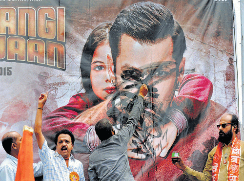 IN PROTEST: Shiv Sena workers blacken actor Salman Khan's poster in Satara, Maharashtra, on Sunday. PTI