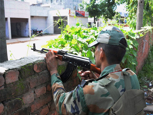 An army jawan takes position during an encounter with militants who attacked a police station at Dinanagar in Gurdaspur district. The attack in Gurdaspur resonated in Lok Sabha today with members cutting across party lines condeming it and saying that the incident demonstrated that the terror threat to India is 'perceptible' and that all force should be used to fight the scourge. PTI