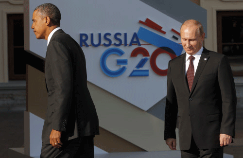 US President Barack Obama with his Russian counterpart Vladimir Putin. AP File Photo