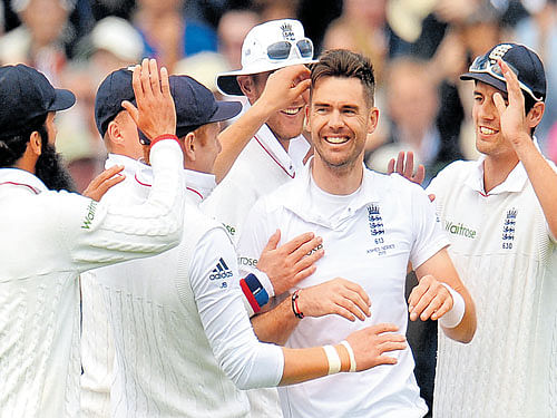 James Anderson (second from right) celebrates the dismissal of Australia's Peter Nevill. Reuters