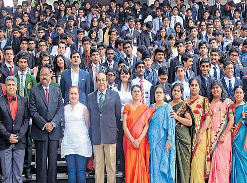 Participants pose for the shutterbugs at the Cottons Model United Nations,organised by the Bishop Cotton Boys' School, in Bengaluru on Thursday. School Principal John K Zachariah, guest Indian Army General (retired) Syed Ata Hasnain and others are seen. DH PHOTO