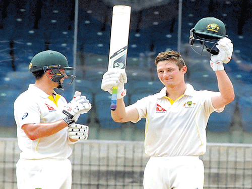 Fine knock: Cameron Bancroft of Australia 'A'  celebrates after reaching his century against  India 'A' in Chennai on Thursday. BCCI