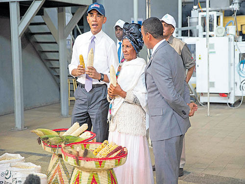 Making a case: President Obama talks with workers as he tours the Faffa Food factory in Addis Ababa, Ethiopia. During his visit to Africa, he essentially made the argument that Washington offers a better, more empowering vision for the continent's future than China does. NYT