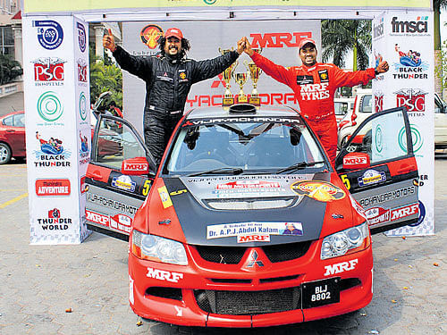 TWO GOOD: Lohitt Urs (left) and Srikanth Gowda celebrate with their spoils after winning the IRC Overall title in Coimbatore on Saturday.