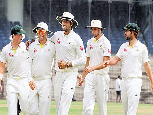 spearhead: Gurinder Sandhu (centre) of Australia 'A' bagged four wickets to hasten the end of India 'A' second innings on Saturday. bcci