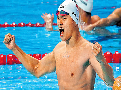 scream of delight: China's Sun Yang exults after successfully retaining his 400M freestyle world championship title in Kazan on Sunday. reuters