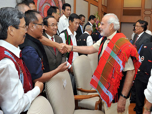Prime Minister Narendra Modi meets NSCN leaders at the signing ceremony of  peace accord  on Monday. PTI
