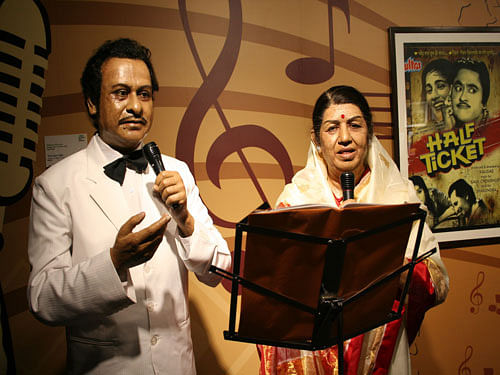 Kishore Kumar and Melody queen Lata Mangeshkar. PTI File Photo.