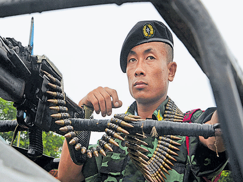 NSCN(IM) cadre stands guard during the 68th 'Naga Independence Day' in Hebron, Nagaland. Photo by Caisii Mao/File photo