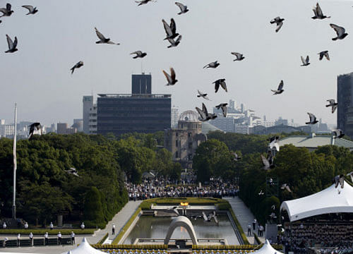 Doves fly over Peace Memorial Park with Atomic Bomb Dome in the background, at a ceremony in Hiroshima. Reuters photo