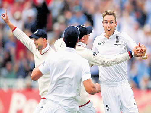 England's Stuart Broad celebrates with team-mates after dimissing Australian batsman Adam Voges on Thursday. Reuters