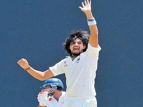 fiery Ishant Sharma successfully appeals for an LBW verdict against Kaushal Silva in Colombo on Friday. afp
