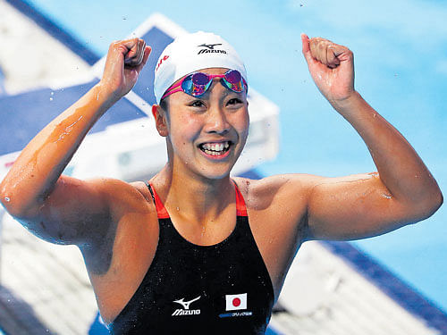 sensational Japan's Kanako Watanabe celebrates after winning the women's 200M breaststroke final at the Aquatics World Championships in Kazan, . reuters