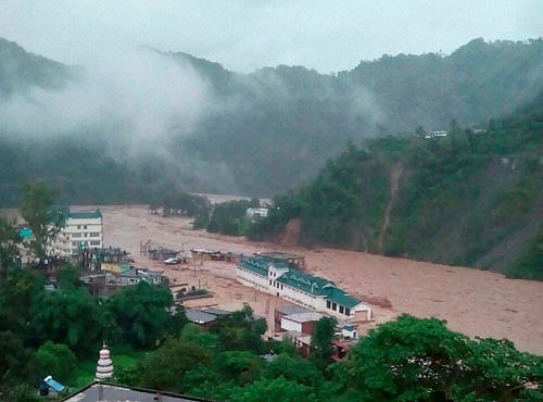 Flooded Dharampur market and bus station after a cloud burst in Mandi district of Himachal Pradesh on Saturday. PTI Photo