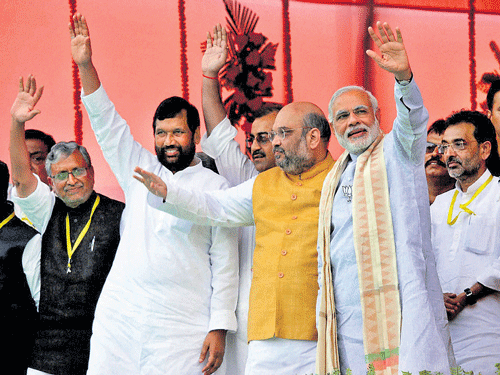 standing united: Prime Minister Narendra Modi, BJP president Amit Shah, Rashtriya Lok Samata Party president Upendra Kushwaha, Union minister Ram Vilas Paswan and  senior BJP leader Sushil Kumar Modi wave to the public during the Parivartan rally at Gandhi Maidan in Gaya on Sunday.  pti