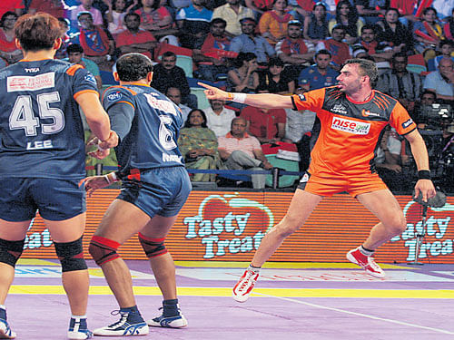 man for the job Mumbai's Anup Kumar (right) completes a  successful raid against Bengal Warriors on Sunday.