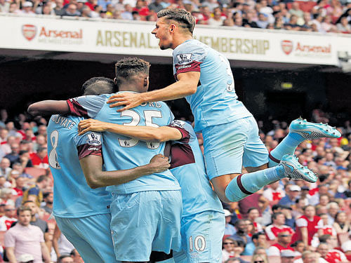 What a start!!: West Ham United players celebrate their opening goal against Arsenal on&#8200;Sunday. reuters