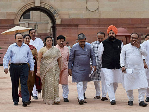 Minister of Science and Technology Harsh Vardhan along with other Delhi BJP leaders speaks to media after submitting a memorandum to President Pranab Mukherjee, at Rashtrapati Bhavan in New Delhi on Monday. PTI Photo