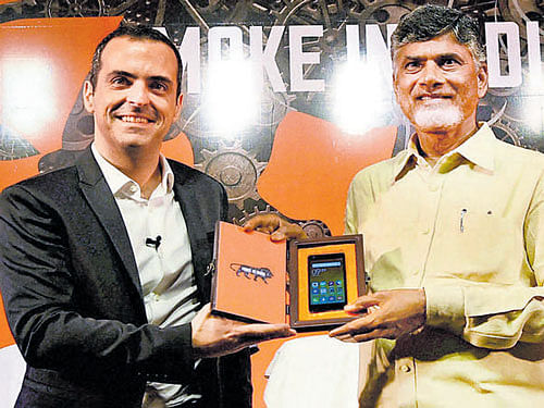 Andhra Pradesh Chief Minister N Chandrababu Naidu (right) with Xiaomi Vice President Hugo Barra, during the launch of India's first Xiaomi-manufactured smartphone in  Visakhapatnam on Monday. PTI