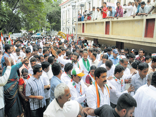 N&#8200;A&#8200;Haris, Shanthinagar MLA, leads a procession of Congress candidates to the office of the returning officer on Monday.  dh photo