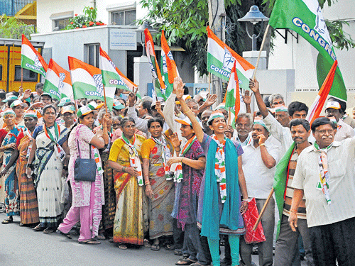 Congress party workers take out a rally on Cambridge Road in Jogupalya ward  on Tuesday for the upcoming BBMP elections. DH PHOTO