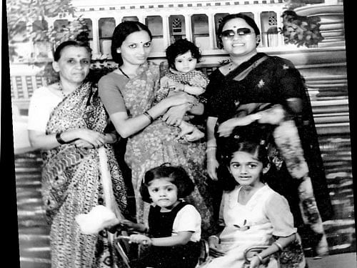 (Standing, from left to right) Late Susheelamma, Vasudha Gopal who is carrying Sandhya and KS Ratna. (On the cycle) Roopa and the author.
