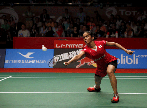 India's Saina Nehwal returns a shot to Indonesia's Lindaweni Fanetri during their women's singles semi-final badminton match at the BWF World Championship in Jakarta, Indonesia. Reuters photo