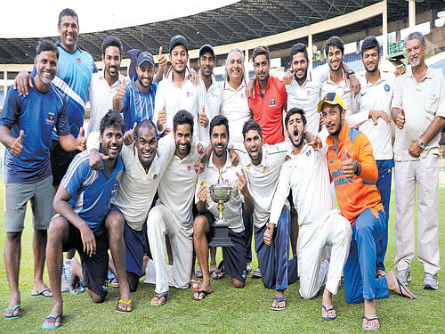 champions DY Patil Academy, winners of the Dr K Thimmappaiah memorial all-India cricket tournament at the Chinnaswamy Stadium in Bengaluru on Saturday. Standing (from left): Ashok, Abey, Swapnil, Shoaib, Akhil, Shashank, Salvi A G (coach), Shubham, Gaurav, Kevin, Jalaj and Sudhakar Rao M S (local manager). Kneeling: Yogesh Takawale, Dinesh Salvinkhe, Prateek, Iqbal, Vikranth, Sarvesh and Puneeth. DH photo