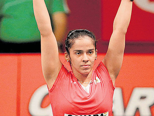 In touching distance: Saina Nehwal celebrates after defeating Indonesia's Lindaweni Fanetri in the women's singles semifinal match at the World Badminton Championships at the Istora Stadium in Jakarta on Saturday. PTI