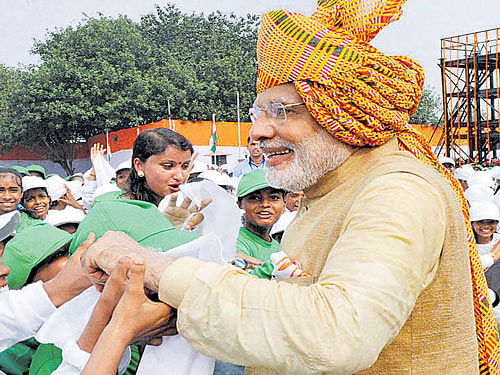 Prime Minister Narendra Modi interacts with students after his address to the nation during the Independence Day function at the Red Fort in New Delhi on Saturday. PTI