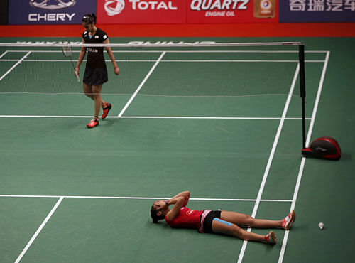 Spain's Carolina Marin reacts after winning against India's Saina Nehwal at BWF World Championships in Jakarta. Reuters photo