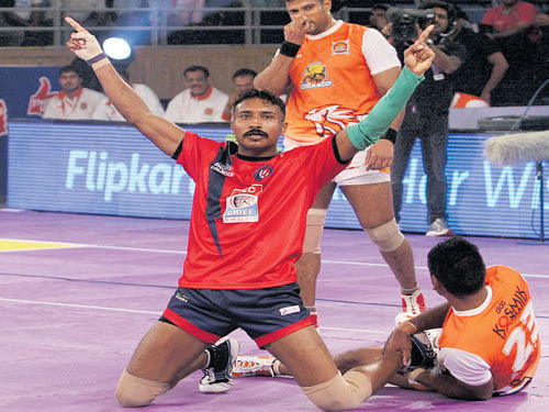 super touch Dabang Delhi's Kashiling Adake celebrates after a successful raid during their Pro Kabaddi League match against Puneri Paltan in Pune on Sunday.