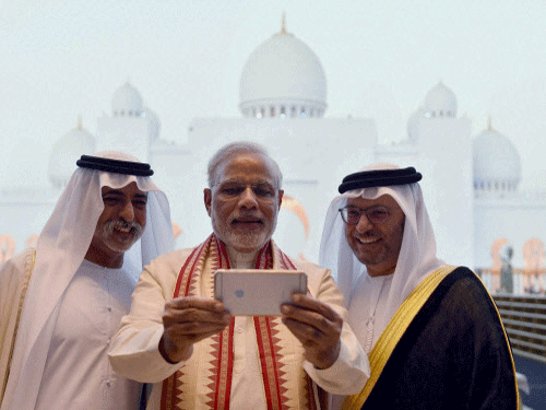 Prime Minister Narendra Modi takes a selfie with Sheikh Hamdan bin Mubarak Al Nahyan, UAE Minister of Higher Education and Scientific Research, during his visit to the Sheikh Zayed Grand Mosque, in Abu Dhabi, UAE. PTI photo