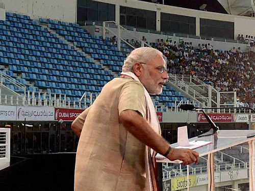 Prime Minister Narendra Modi's addresses people at a cricket stadium in Dubai on Monday. PTI Photo